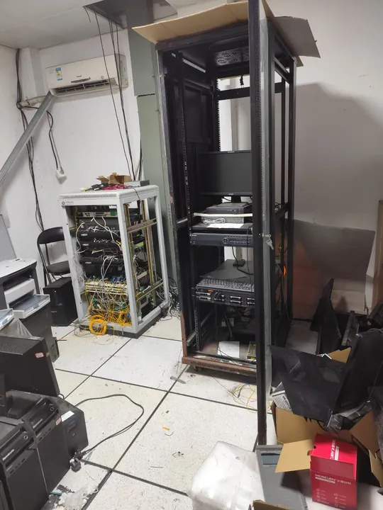 On-site IT asset recovery assessment with server rack and network equipment