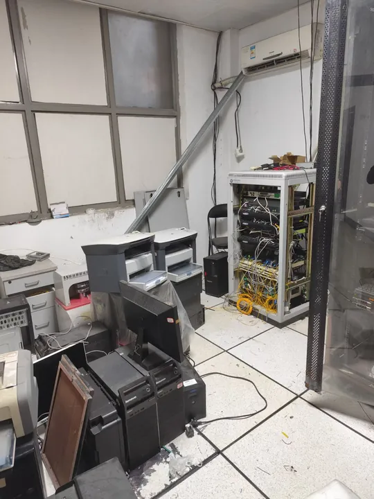 Network rack and retired office IT equipment at a customer site